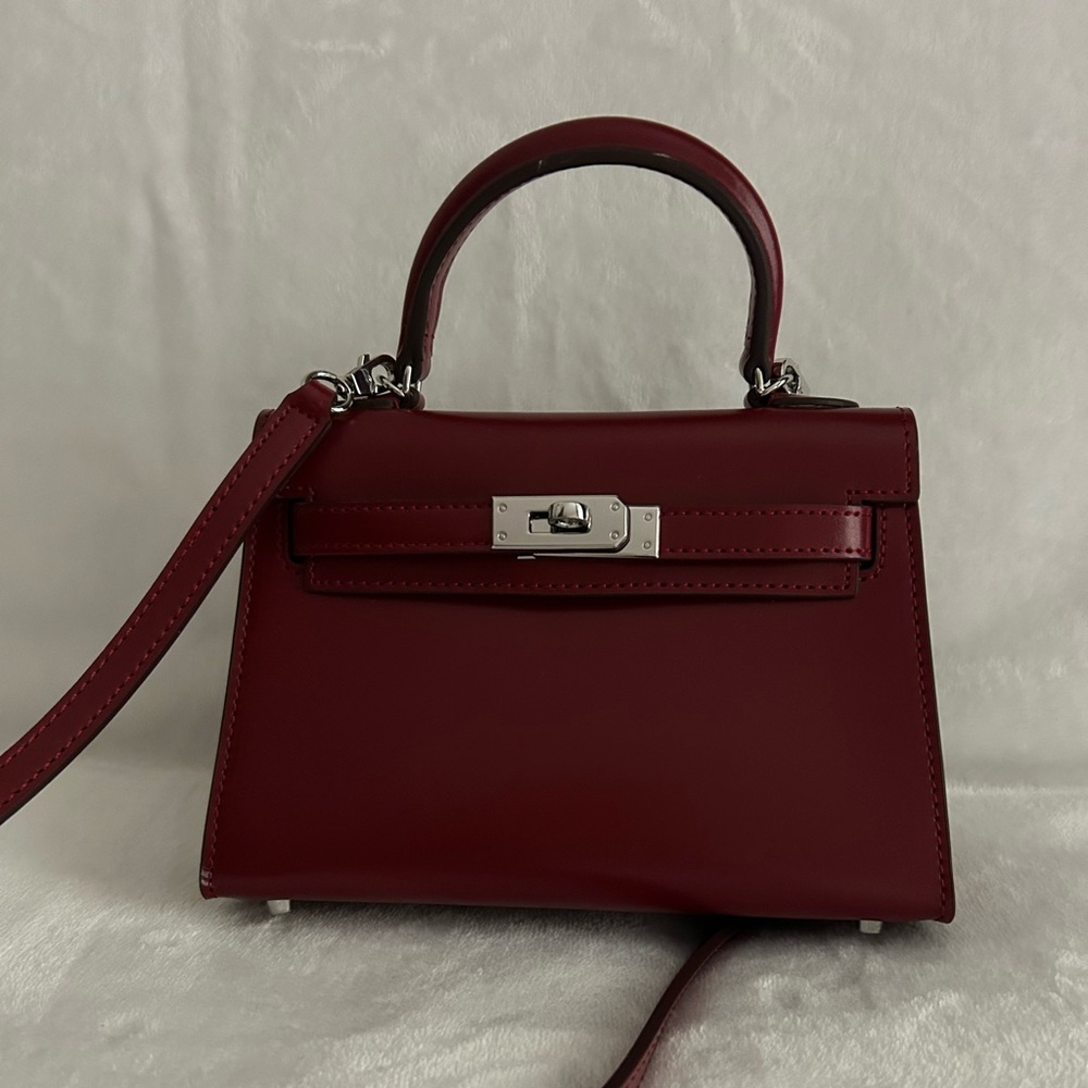 Red leather mini “Kelly” inspired handbag.